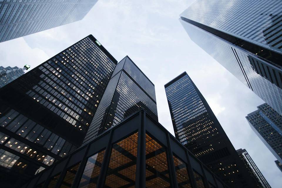 Glass office towers seen from below